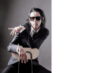 DR JOHN COOPER CLARKE TAKES ‘THE LUCKIEST GUY ALIVE’ TOUR TO WALES FOR TWO INTIMATE DATES