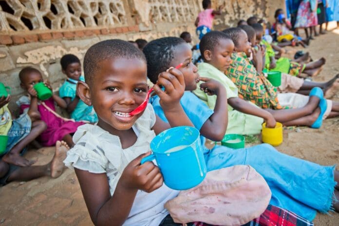 A child in Malawi receives Marys Meals
