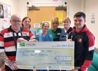 Youth rugby team supports coach by fundraising for chemo unit