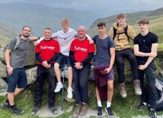Firefighters Carry Casualty During Charity Challenge