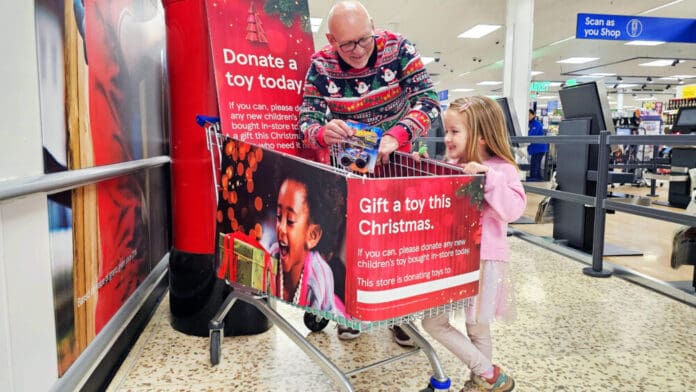 Grandad-and-grandaughter-at-donation-point-scaled.jpg